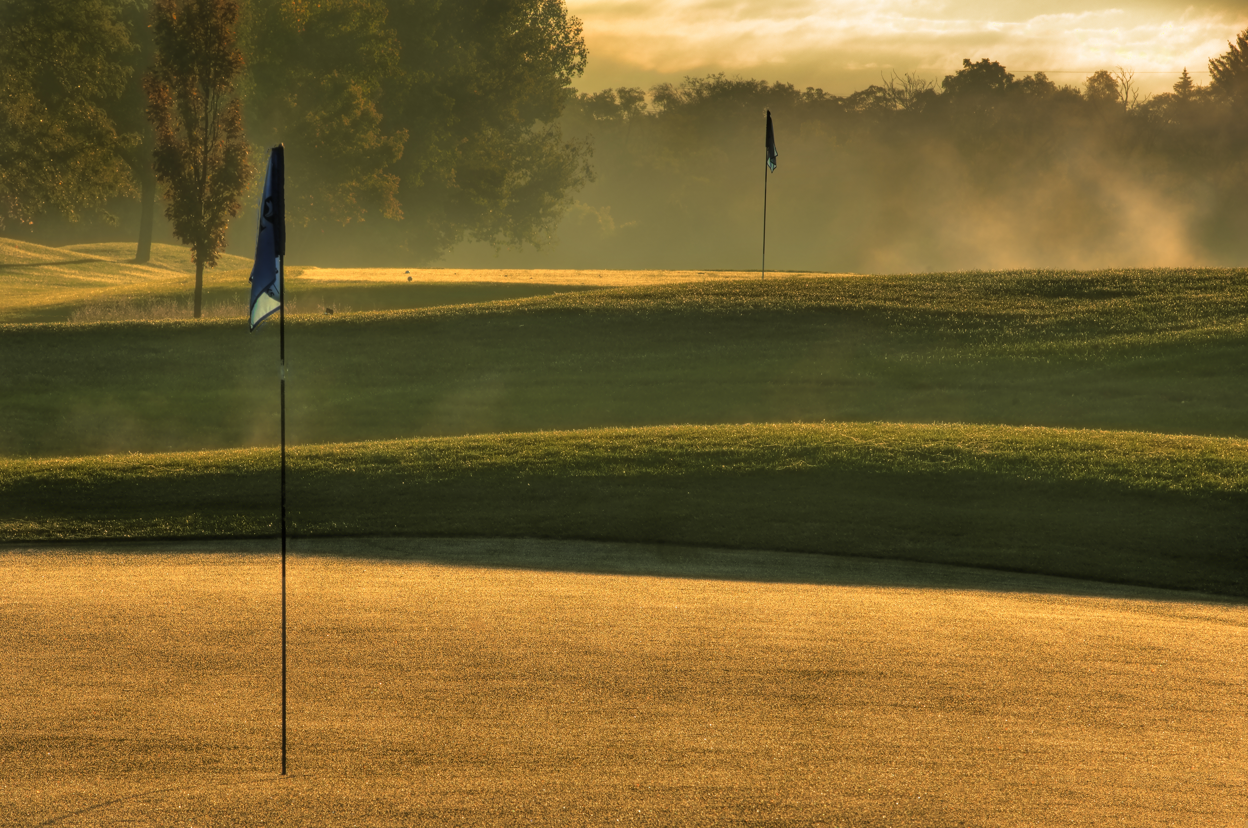 view of golf course hole with flag