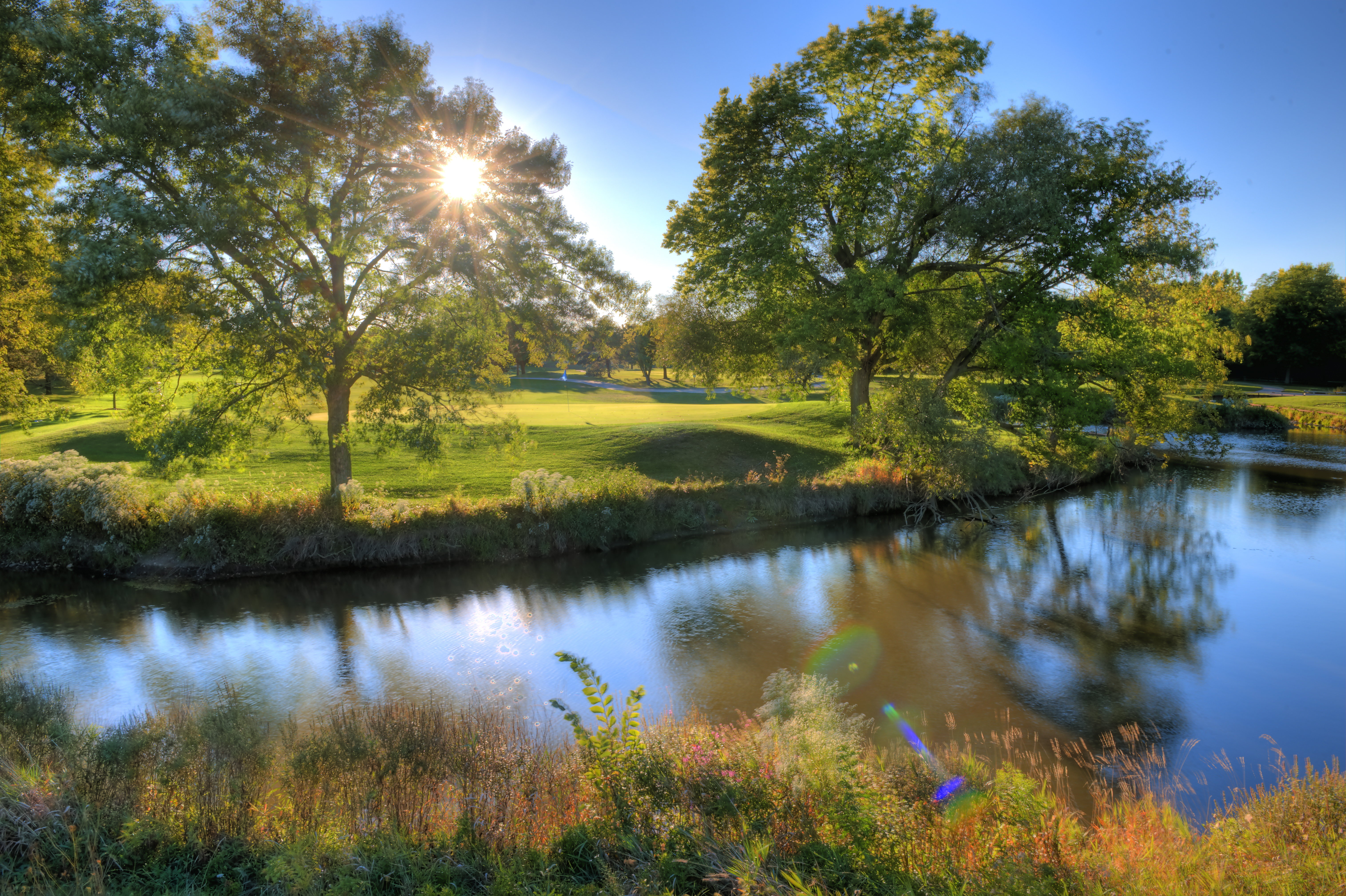 view of golf course hole with flag